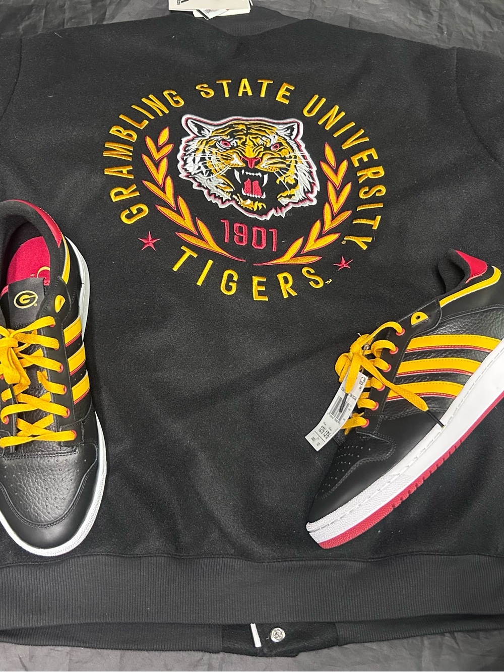 Adidas Grambling State University Mens XXL Fleece Letterman Jacket and sneakers.